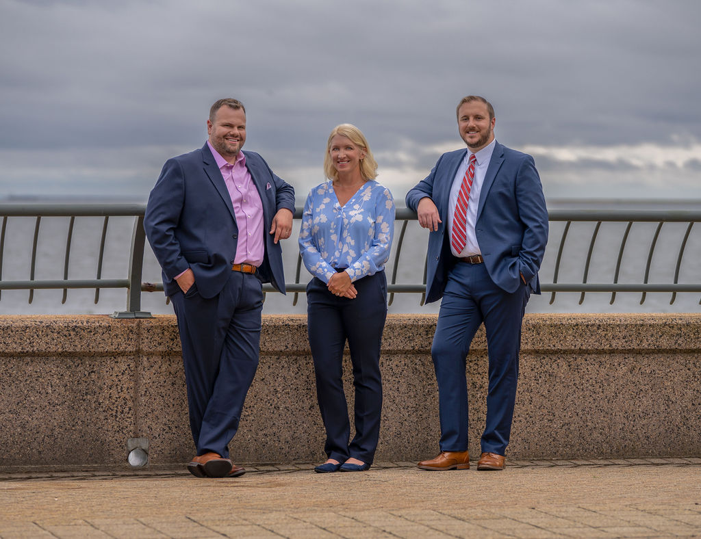 Attorney Trevor Doyon with paralegal Ahsley David and Attorney Patrick White at long wharf